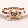 Flower bow breakaway cat collar in soft velvet with safety buckle and bell — KittyTag handmade — view 1